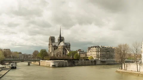 Medium zooming timelapse of Notre Dame in Paris sourrounded by the Seine Stock Footage 62197373