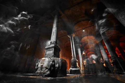 Medusa head with blurred peope in the Basilica Cistern. Stock Photos