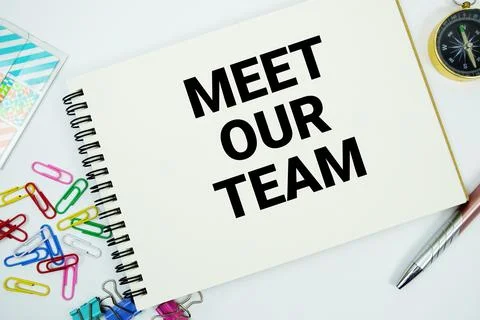Meet Our Team text message written on notepad with stationery flat lay on w.. Stock Photos