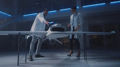 Meeting of Aerospace Engineers Working On Unmanned Aerial Vehicle Prototype Stock Footage 106072207