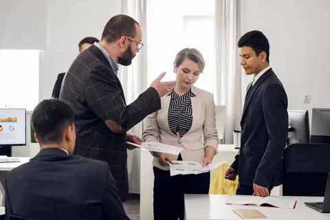 Meeting and analysis of the development strategy of a young company selling Stock Photos
