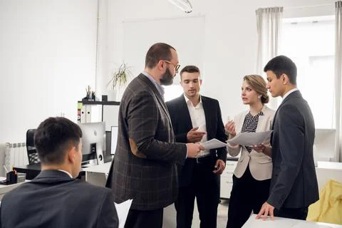 Meeting and analysis of the development strategy of a young company selling Stock Photos