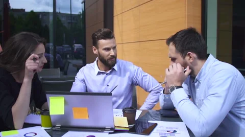 Meeting between business people on a table Stock Footage 64286512