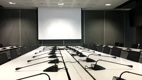 Meeting conference room empty table microphone chair corporate boardroom Stock Footage 334027314