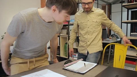 Before the meeting, designer prepares samples of materials for client. Stock Footage 78709656