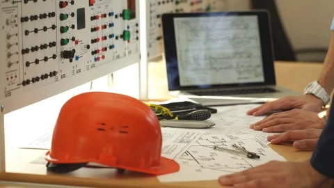 Meeting of the engineers design team working and discussion on construction Stock Footage 70798047