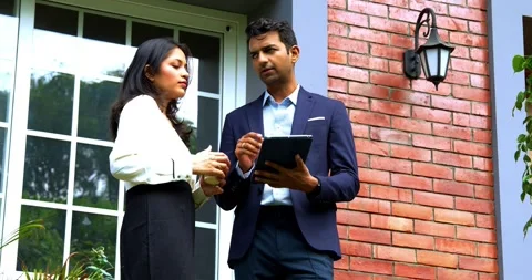 Meeting outdoor discussing project ideas on porch with tablet and coffee Stock Footage 342592453
