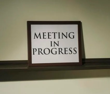 Meeting in progress sign Stock Photos