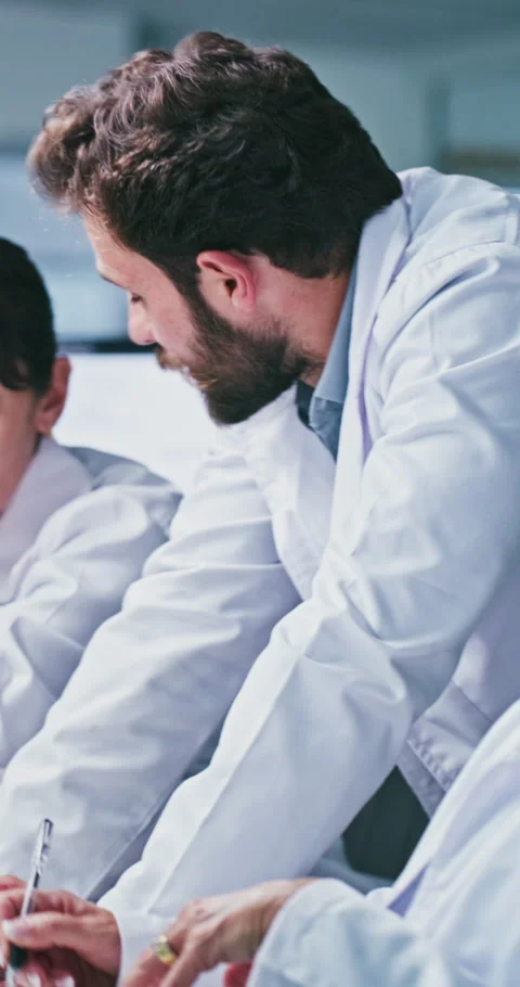 Meeting, science and people with computer in lab for procedure, report or Stock Footage 331350737