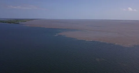Meeting of the waters of the Amazon River (brown) and Rio Tapajós (blue). Stock Footage 99114505