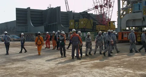 A meeting of workers before the start of a new work shift at the shipyard. Stock Footage 165643223