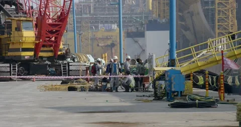 A meeting of workers before the start of a new work shift at the shipyard. Stock Footage 231214875
