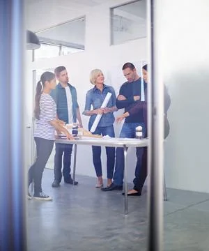Meetings are always a practical alternative to work. Full length shot of a group Stock Photos