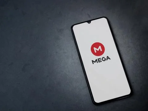 MEGA app launch screen with logo on the display of a black mobile smartphone  Stock Photos