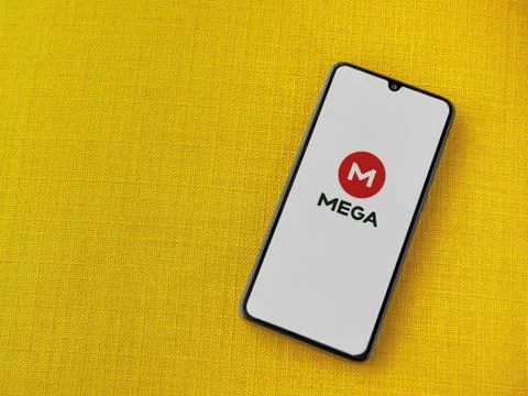 MEGA app launch screen with logo on the display of a black mobile smartphone  Stock Photos