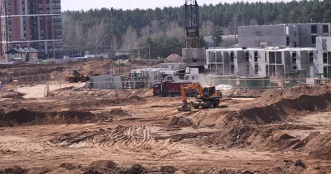 Mega Construction Site: Tracking a Dump Truck on Sandy Ground Stock Footage 242113941