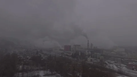 Mega factory producing gasses in the small town on a foggy winters day, 4K Stock Footage 73241506