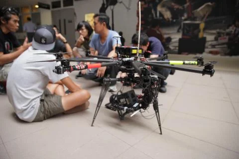 A mega pro drone 8 propeller flying machine with a RED camera mounted on it Stock Photos