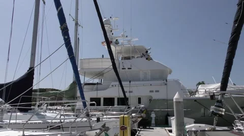 Mega yacht being prepared to sail in the early morning light of Newport Beach Stock Footage 67512463