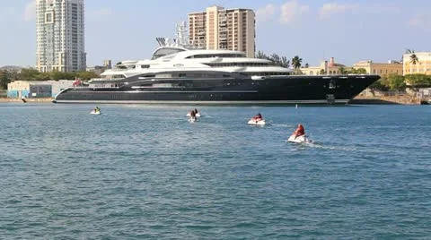 Mega yacht super yacht luxury ship Serene and jet ski Stock Footage