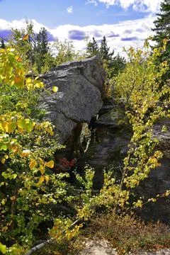 Megalithic rocks of quartz sandstone with a through opening in the Kamenny Go Stock Photos