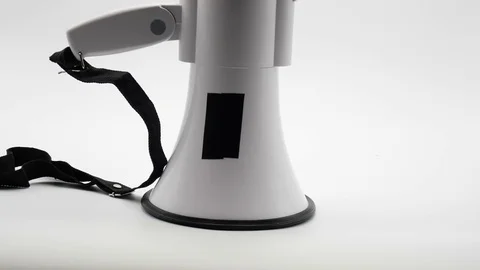 Megaphone Being Pushed Over Bouncing off Floor Isolated on White Stock Footage 80936693