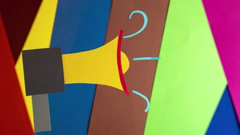 Megaphone on a bright multicolored background, stop motion, animation. Stock Footage 159345153