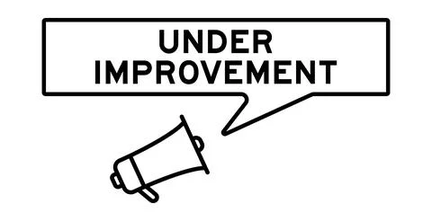 Megaphone icon with speech bubble in word under improvement on white backgrou Stock Illustration