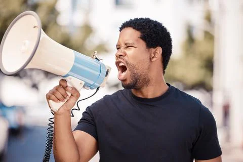 Megaphone, protest and angry black man talking at riot in Nigeria. Announcement Stock Photos
