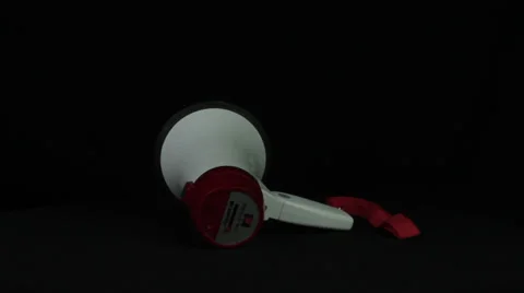 Megaphone turns on a black background loop Stock Footage 34660417