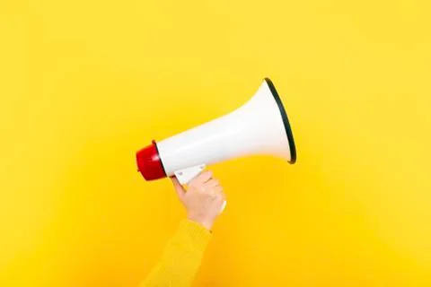 Megaphone on a yellow background Foto stock