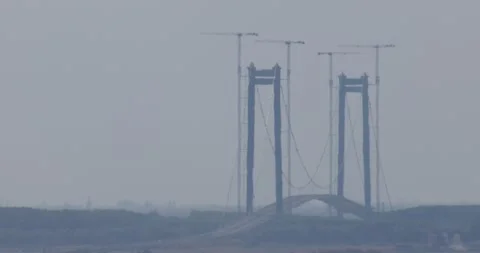 Megastructure Rising: Aerial Cranes Building Braila-Tulcea Suspension Stock Footage 249797833