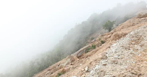 Meghalaya often lead to dramatic landslides that reshape roads Stock Footage 335553191