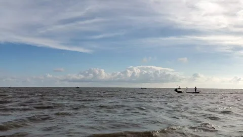 Meghna River Waves and Distant Fishing Boats in Bangladesh Stock Footage 344882496