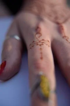 Mehendi pattern on woman's hand Stock Photos