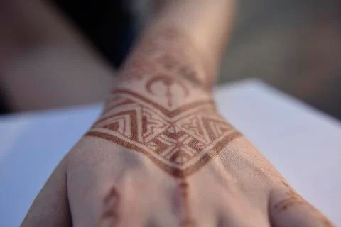 Mehendi pattern on woman's hand Stock Photos