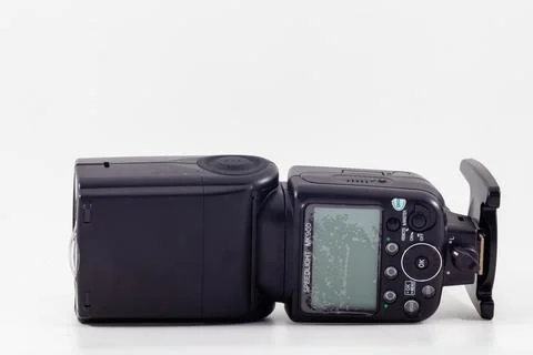 A meike MK-900 flash unit isolated in white background Stock Photos