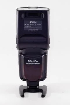 A meike MK-900 flash unit isolated in white background Stock Photos