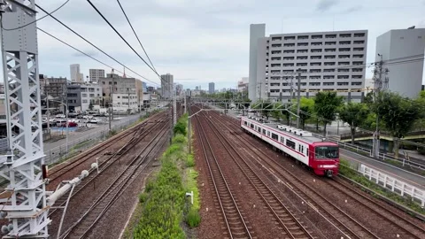 A Meitetsu train passing through urban area in Nagoya, Japan Vídeo Stock 297598935