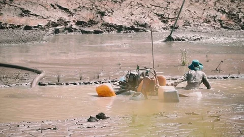 Mekong Delta farmer constructing shrimp farm pond Stock Footage 107991612