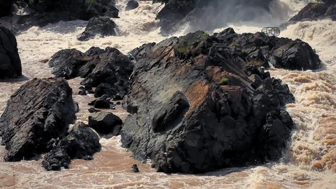 Mekong river, Laos. Rocks surrounded by Mekong rapids in july. Stock Footage 111246779