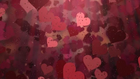 Melancholy concept with red hearts floating and falling behind rainy window Stock Footage 345375631