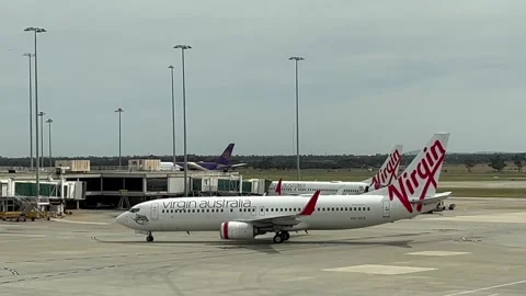 Melbourne: Boeing 737 passenger jet of Australian airline Virgin Australia, 4K Stock Footage 297773418