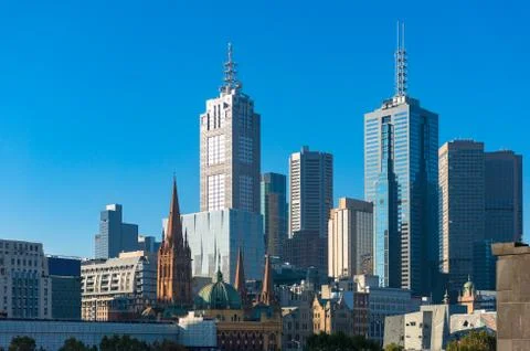 Melbourne CBD view wit Flinders station, St Paul's Cathedral and skyscrapers Stock Photos