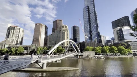 Melbourne: Evan Walker Bridge spanning the Yarra River and city skyline, 4K Stock Footage 291514275