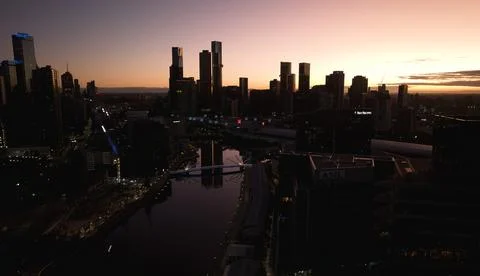 Melbourne Skyline lighted up with reflection in the river. Stock Photos