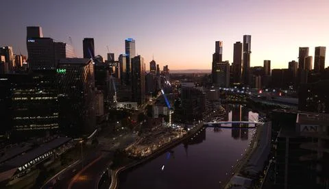 Melbourne Skyline lighted up with reflection in the river. Stock Photos