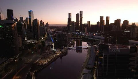 Melbourne Skyline lighted up with reflection in the river. Stock Photos