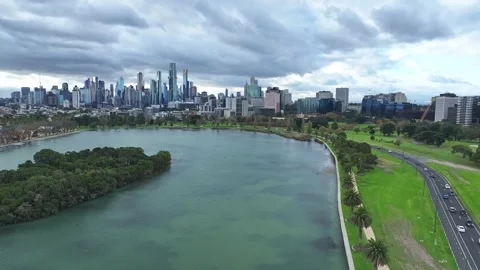 Melbourne skyline as seen from Albert Park with lake view Stock Footage 277965450