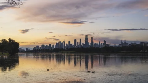 Melbourne skylines day to night sunset time lapse from Albert Park Lake Stock-Footage 312766480